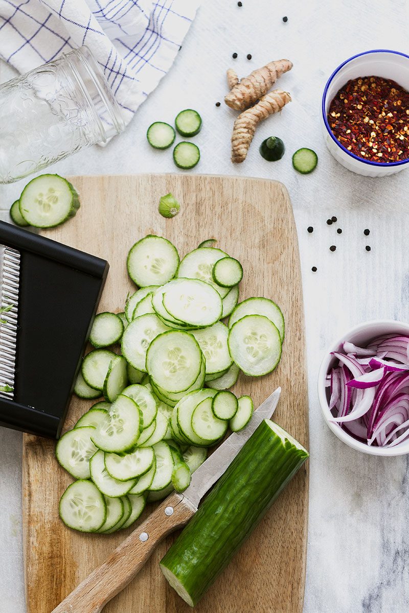 Spicy Sweet Pickled Cucumbers – Quick and easy pickled cucumbers with red onion and turmeric. Only takes a few minutes to make!