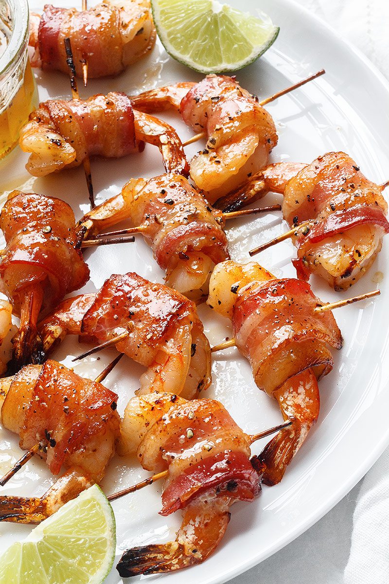 Honey-garlic Bacon Wrapped Shrimp - These crisp and sticky treats are the ultimate last-minute appetizer recipe!