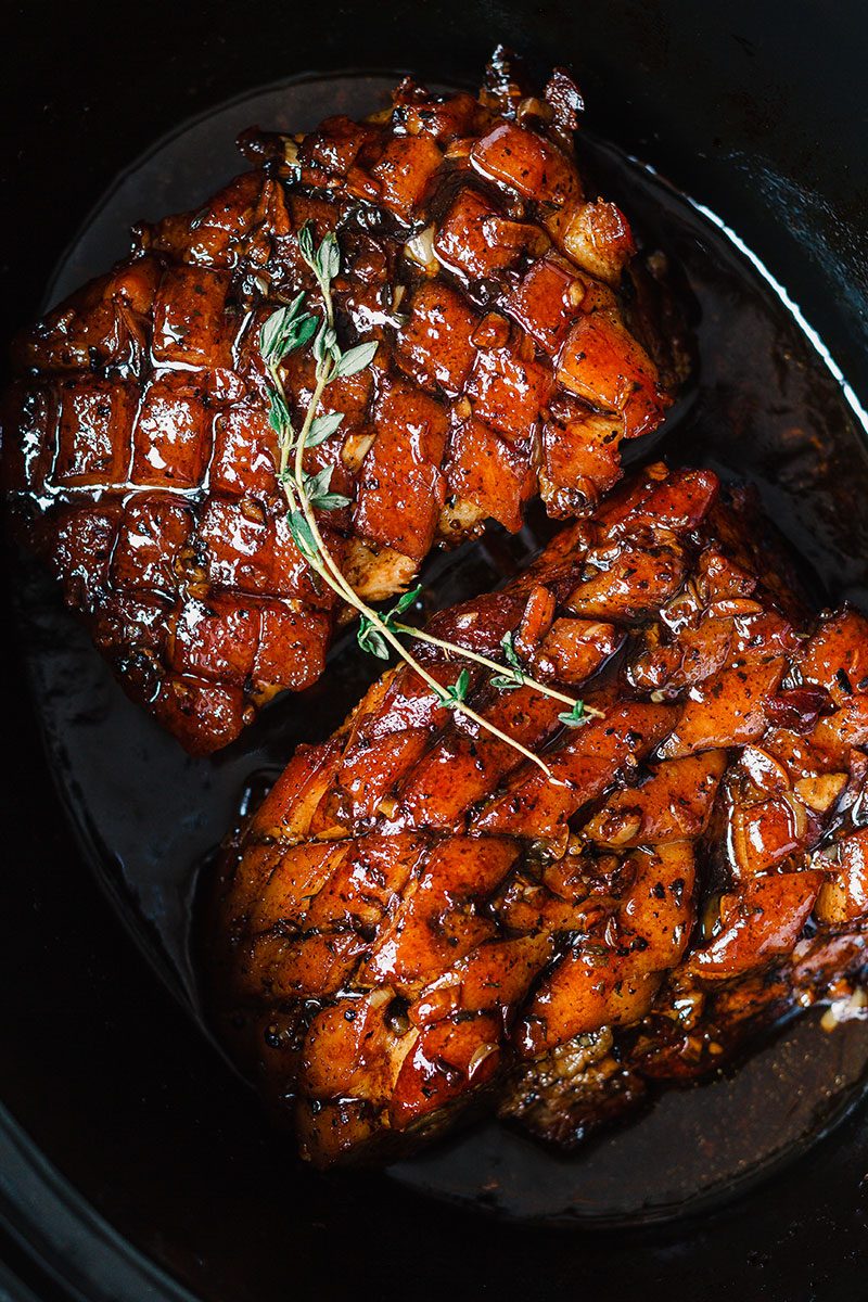 Slow Cooker Pork Belly with Honey Balsamic Glaze - Fall-apart tender and infused with a sticky tangy glaze.
