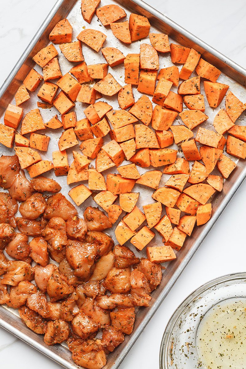 Roasted Chicken and Sweet Potato Meal Prep - Roasted to perfection, this sheet pan chicken and sweet potato is perfect for meal prep.