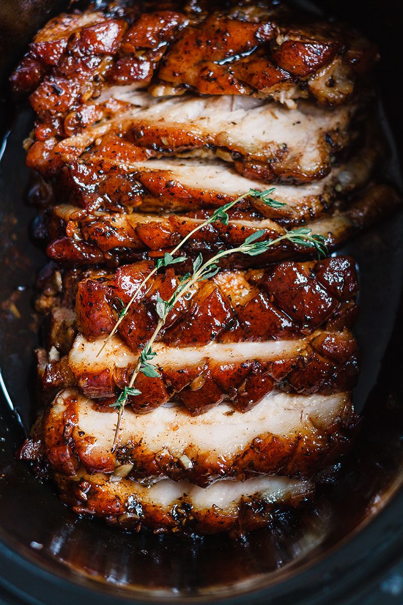 Slow Cooker Pork Belly with Honey Balsamic Glaze - Fall-apart tender and infused with a sticky tangy glaze.