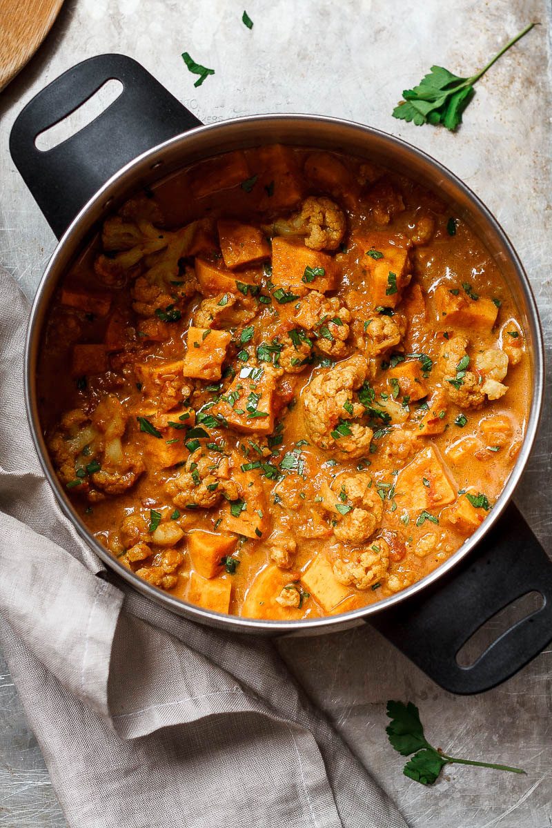 Cauliflower Sweet Potato Curry - A quick and comforting vegan dinner that's loaded with tender sweet potato and cauliflower. 