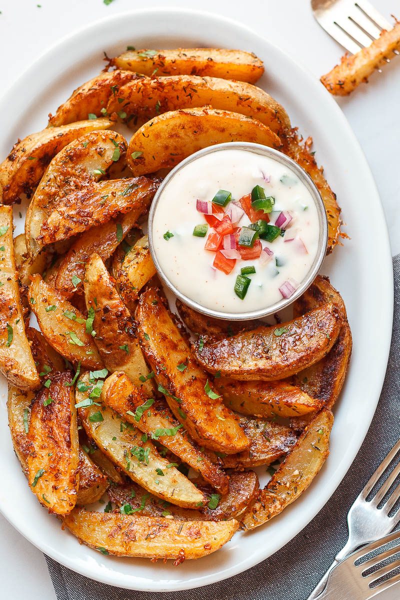 Baked Garlic Parmesan Potato Wedges - Crispy on the outside and tender on the inside, they will blow you away with their simplicity and fantastic flavor!