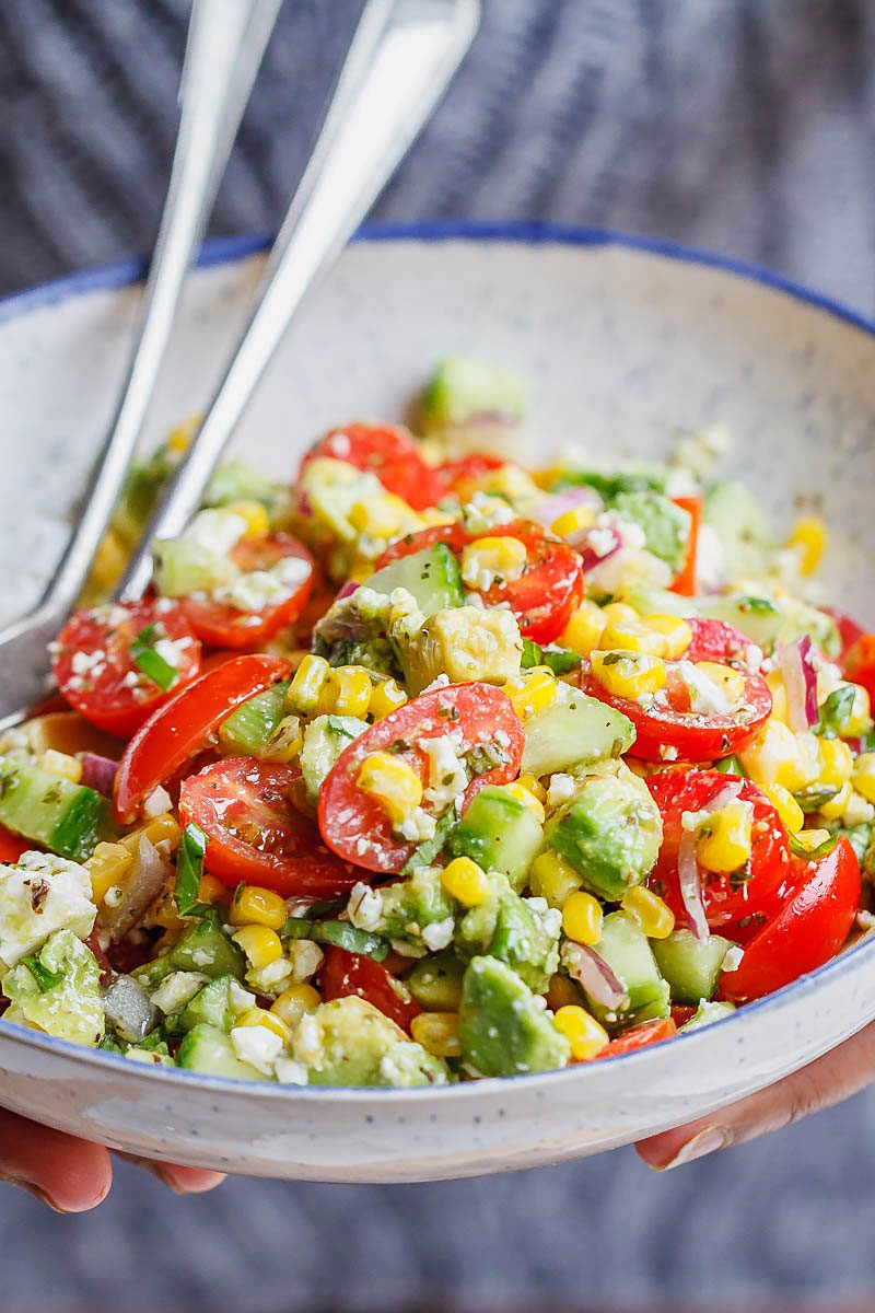 Avocado Feta Corn Salad Recipe - So much creaminess and flavor! This avocado corn salad is a light, yet satisfying meal.