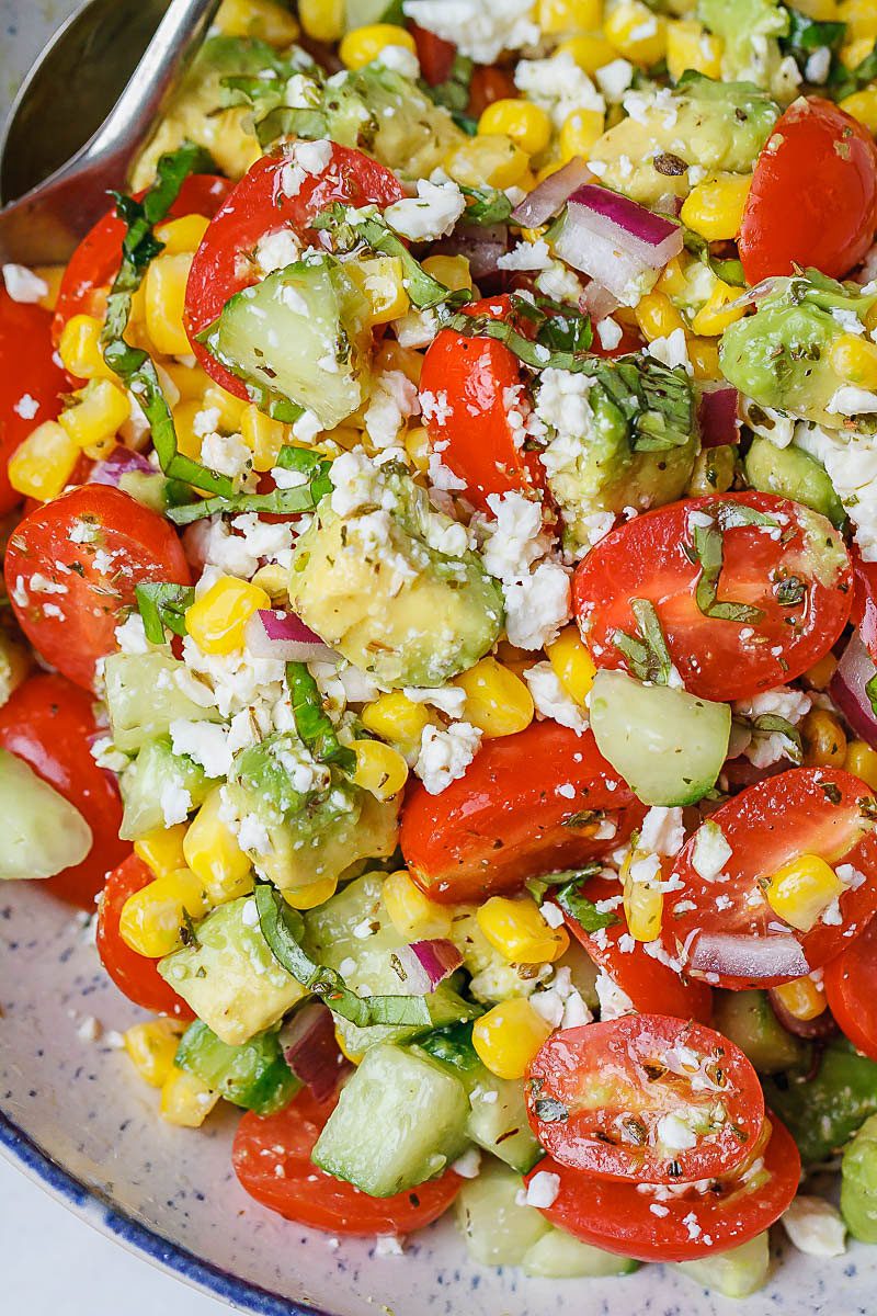Avocado Feta Corn Salad Recipe - So much creaminess and flavor! This avocado corn salad is a light, yet satisfying meal.