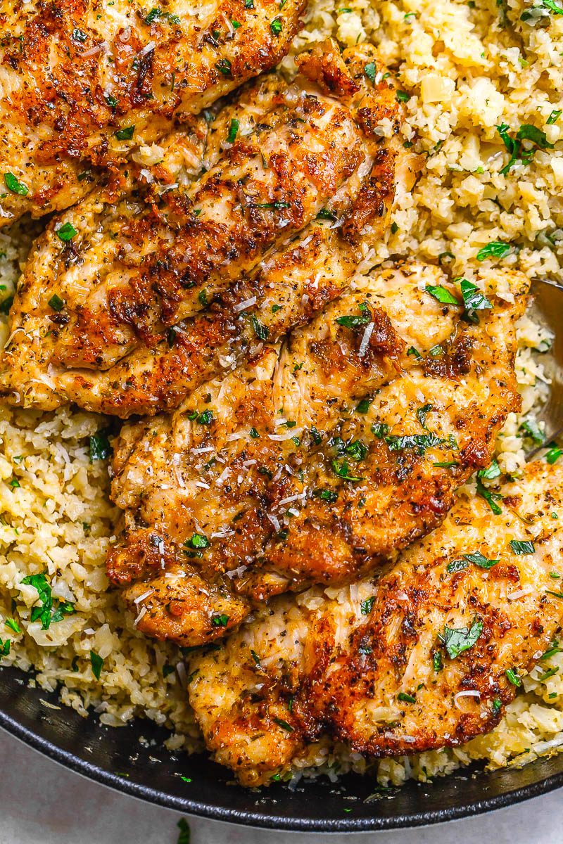 Garlic Butter Chicken with Parmesan Cauliflower Rice - #eatwell101 #recipe Crispy, soft and SO delish! Perfect for when you want to come home to a delicious gluten-free, low-carb dinner. #Garlic #Butter #Chicken #Parmesan #Cauliflower #Rice #glutenfree, l#owcarb #dinner.