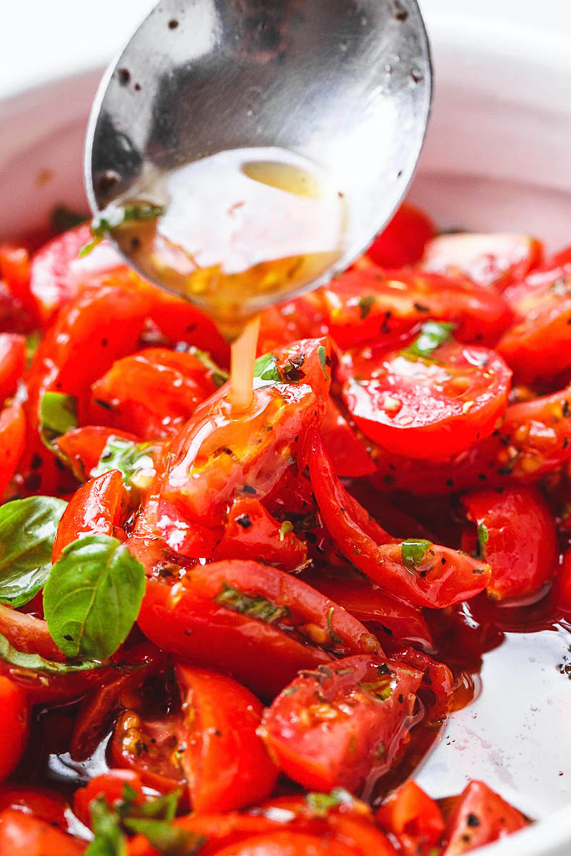 Marinated Cherry Tomato Salad - Really, reeeeeeally delicious! A super simple tomato salad with a punch of flavor.