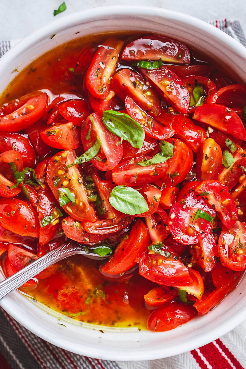 Marinated Cherry Tomato Salad - Really, reeeeeeally delicious! A super simple tomato salad with a punch of flavor.