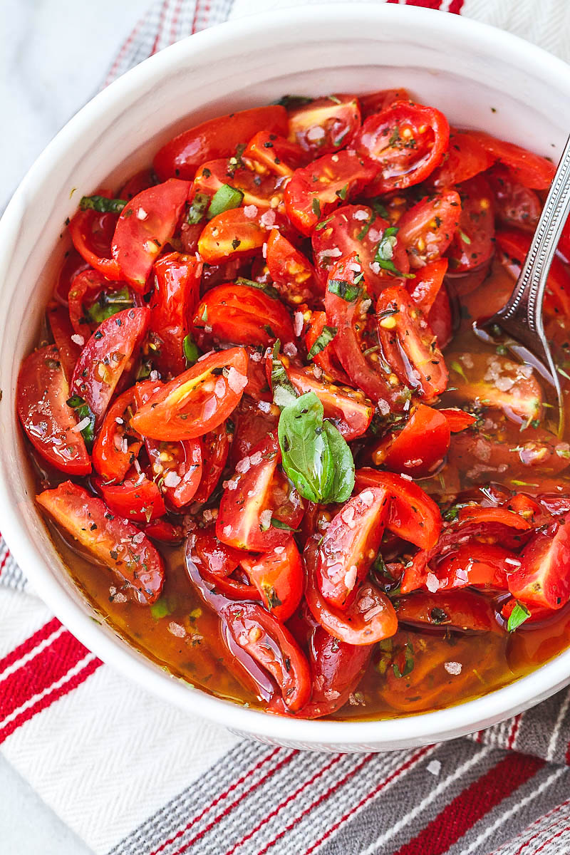 Marinated Cherry Tomato Salad - Really, reeeeeeally delicious! A super simple tomato salad with a punch of flavor.
