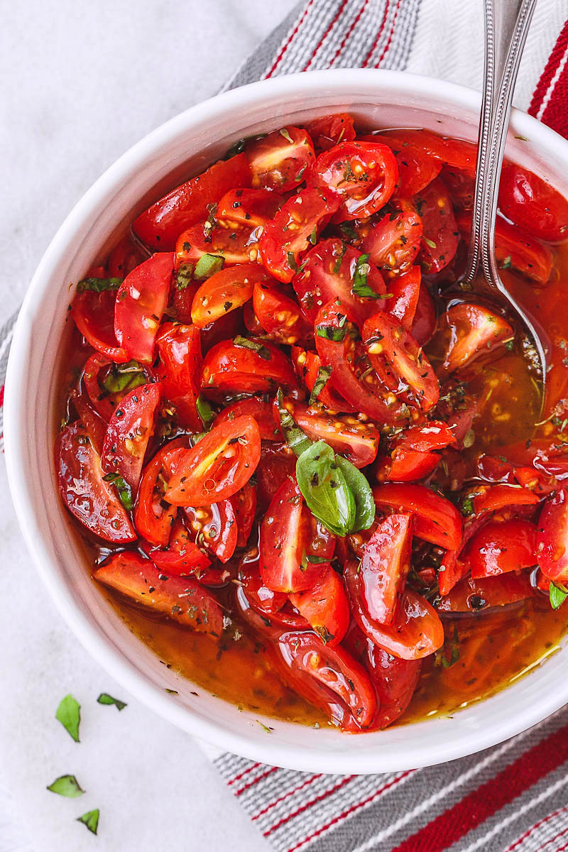 Marinated Cherry Tomato Salad - Really, reeeeeeally delicious! A super simple tomato salad with a punch of flavor.