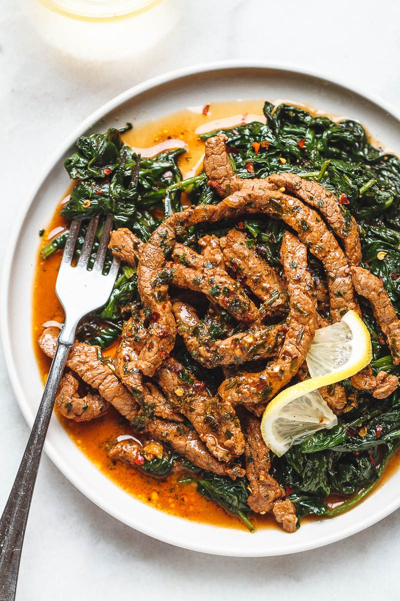 Lemon Garlic Butter Steak and Spinach - Tons of flavor and so easy to make! A quick low carb dinner you’ll be crazy about.