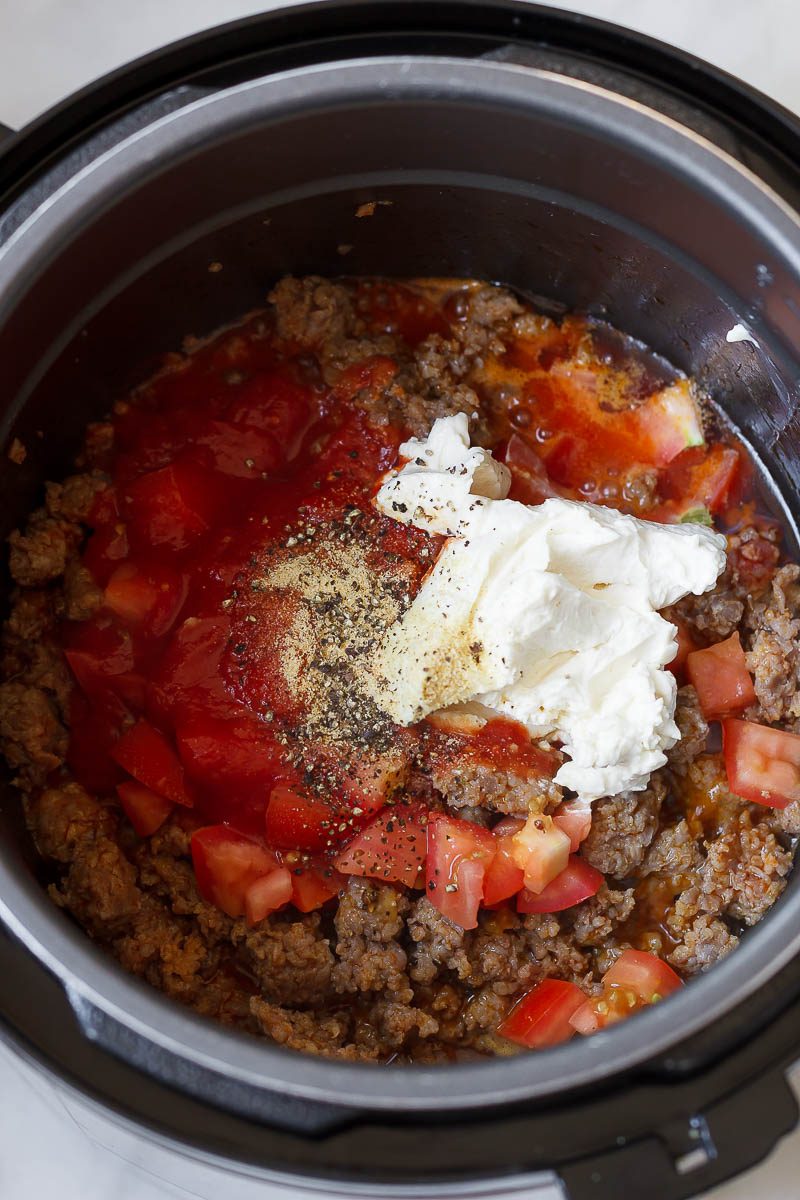 Instant Pot Sausage Pasta in Cream Cheese Tomato Sauce - A Quick and easy one-pot dinner made entirely in the pressure cooker. You will definitely love this one!