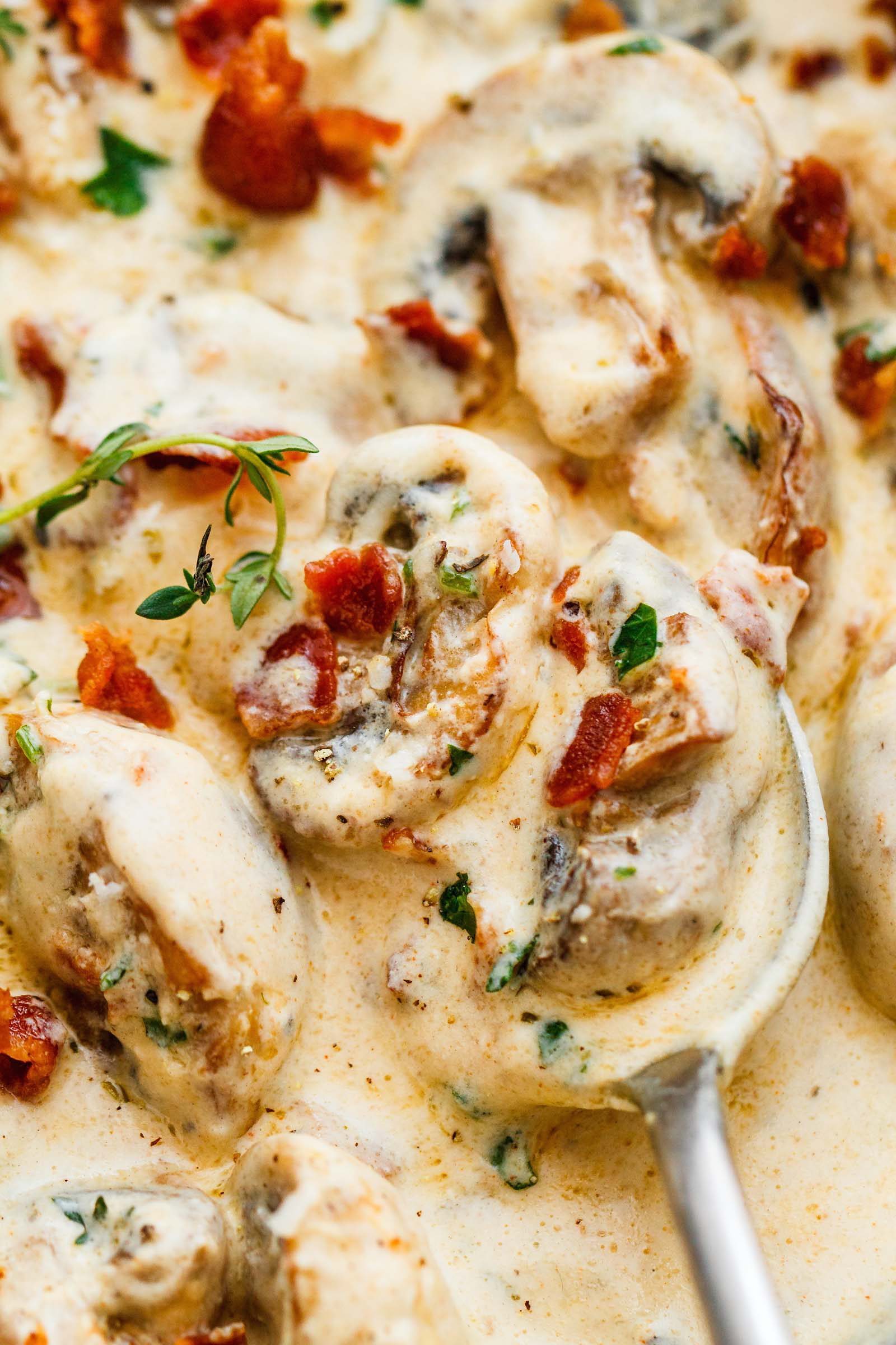 Creamy Garlic Parmesan Mushrooms with Bacon - A decadent garlic parmesan mushroom cream sauce that will have you licking your plate clean!