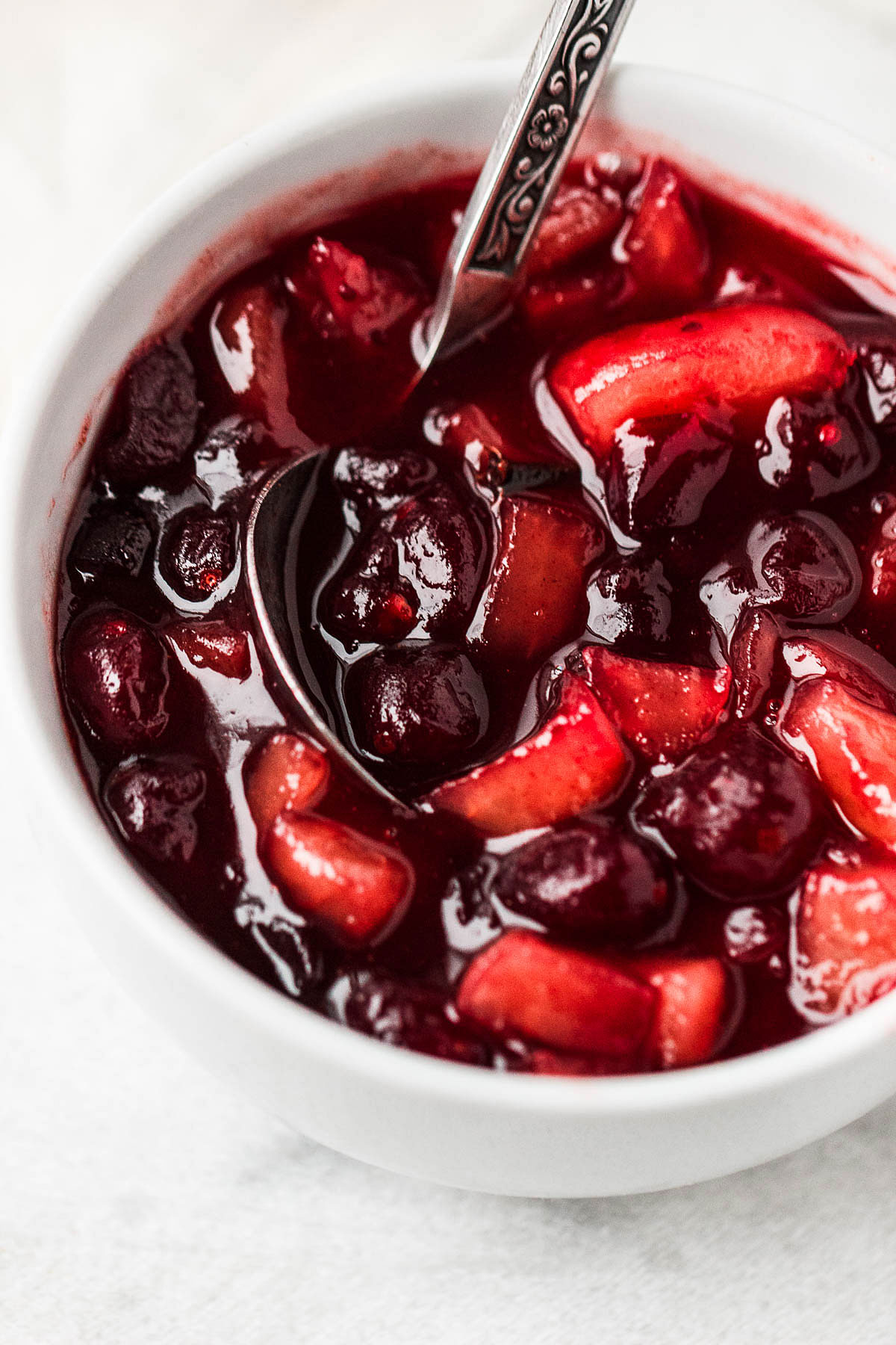 Apple Cranberry Sauce - Our delicious homemade cranberries sauce is simmered to perfection with cranberries, apples, maple syrup, and cinnamon.