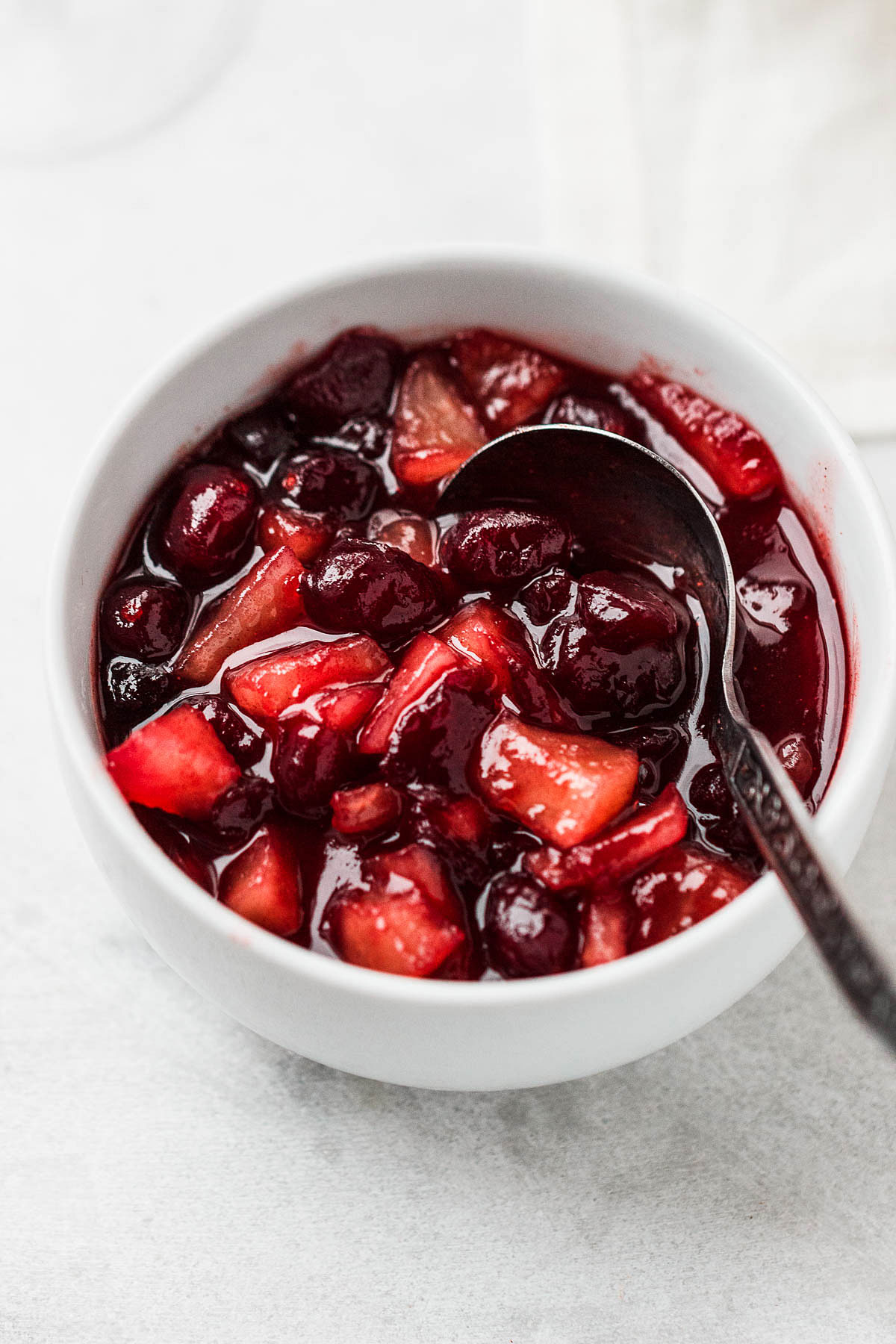Apple Cranberry Sauce - Our delicious homemade cranberries sauce is simmered to perfection with cranberries, apples, maple syrup, and cinnamon.