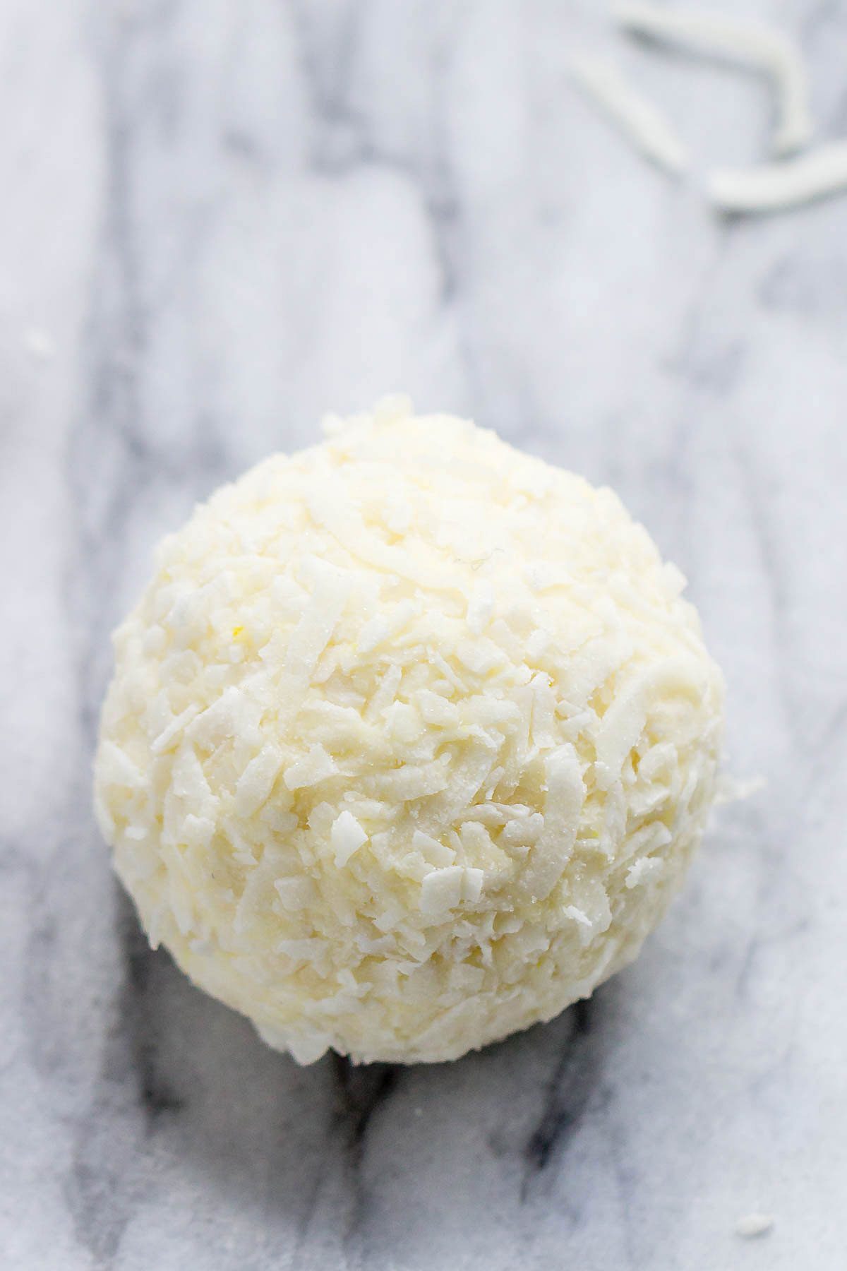 Lemon Cheesecake Keto Fat Bombs - These low-carb, keto fat-bombs are an easy, no-bake frozen treat you can make with simple ingredients. #eatwell101 #recipe #Lemon #Cheesecake #Keto #FatBombs #Lowcarb keto fat boms #low-carb, keto fat boms lemon, keto fat boms coconut oil , keto fat boms recipes, keto fat boms cream cheese, keto snacks, low carb fat bombs, low carb fat boms.